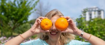 Woman and Oranges Image